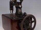 an old sewing machine that is sitting on a table