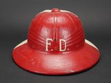 a red fireman ' s hat with the word f d on it