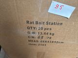 une boîte d'appât à rats posée sur un banc en bois