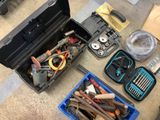 a tool box filled with various tools on the floor