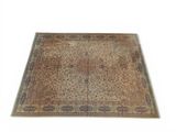 an oriental rug with a cross on the middle of it
