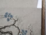 a picture of a picture of a tree with blue flowers