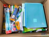 a box full of school supplies and pens and pencils