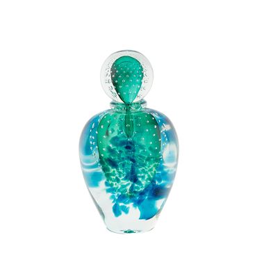a glass bottle with a blue and green design on it