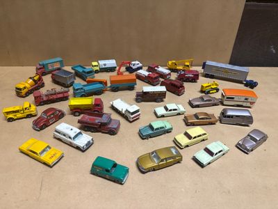 a lot of toy cars that are sitting on a table