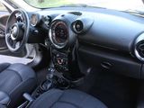 the interior of a small car with a steering wheel and dashboard