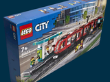 a box with a lego city train set in it