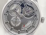 a close up of a watch with a black leather strap