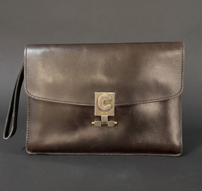 a brown leather purse with a gold metal clasp