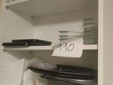 a shelf with dishes and plates on it in the kitchen