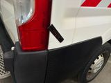 a white van with a red stripe on the back of it