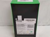 the back of a box with a green label on it