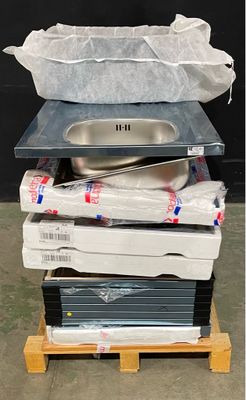 a stack of boxes and pans sitting on a pallet