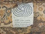 a label on the back of a chair that has a design on it