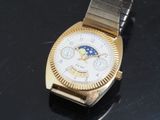 a close up of a watch on a black surface