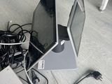 two laptops and a hard drive sitting on the floor