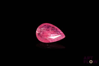 a pink diamond on a black background