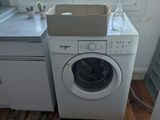 a washer and a dryer in a small room
