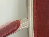 a chair that has a red seat and a red cushion