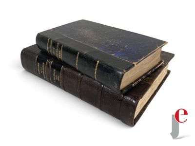 three books stacked on top of each other on a white surface