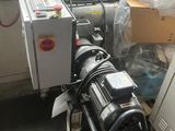 a machine that is sitting on the floor next to a refrigerator