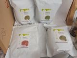 many bags of food that are sitting on a table