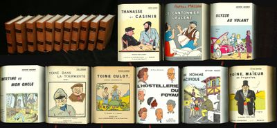 several books are lined up on a table with a black background
