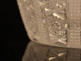 a close up of a glass vase on a table