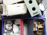 a lot of junk in a blue bin on the floor