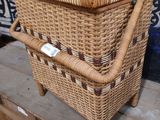 a wicker basket that is on a wooden table