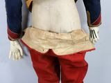 a mannequin dressed in red pants and a blue jacket
