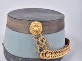 grey and blue hat with gold chain on top of it