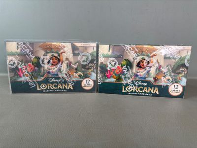 two disney figurines of lora and lora