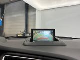 a car dashboard with a monitor in the middle of it