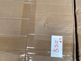 two boxes of food sitting on a carton in a warehouse