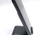 a cell phone that is sitting on a stand
