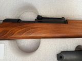 a close up of a rifle on display in a case