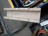 a piece of wood sitting on top of a tool box