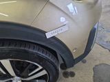 a close up of a car with a sticker on the side of it