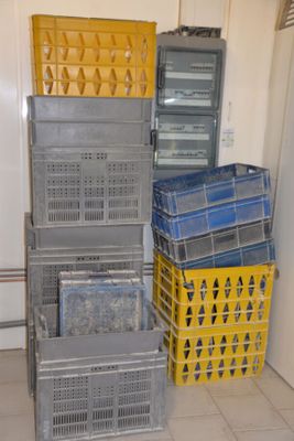 many crates stacked on top of each other in a room