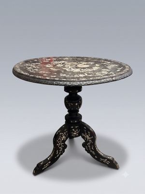 an image of a small table with a flower design on it