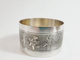 an image of a silver bracelet with a picture of a man and a woman on it