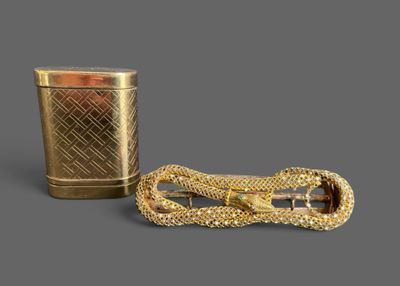 pair of gold - plated hair clips and a gold - plated glass