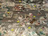 a table covered with lots of stamps and stickers