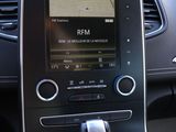the dashboard of a car with a gps device in the center