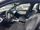 the interior of a car with a steering wheel and a dashboard
