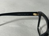a close up of a pair of glasses on a table