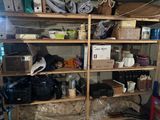 a room with a lot of boxes and other things on the shelves