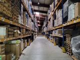 a large warehouse filled with lots of boxes and pallets
