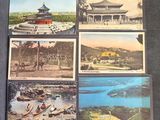 four postcards of asian architecture on display on a table